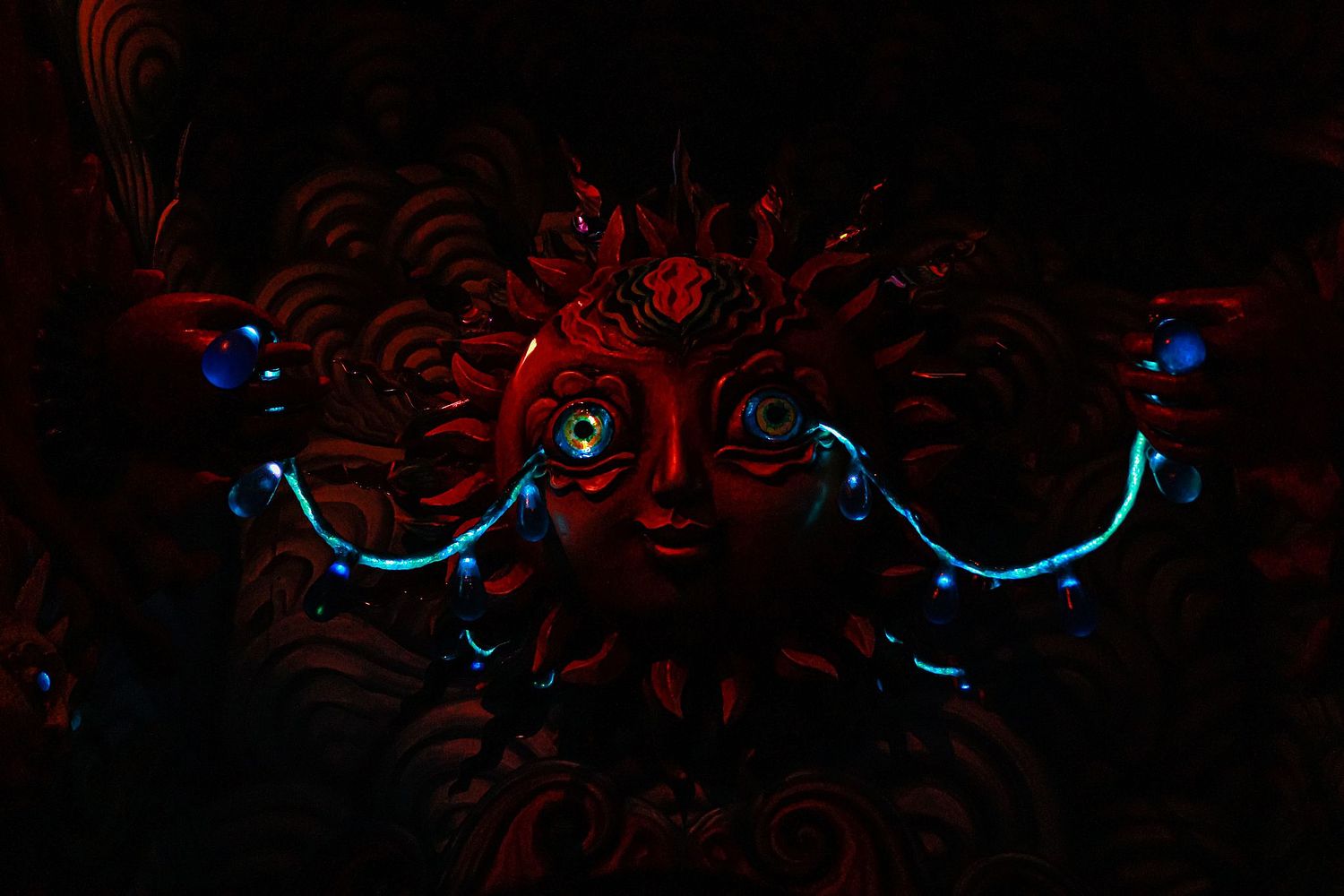 Picture of a crying sun artwork at Meow Wulf, Santa Fe NM.