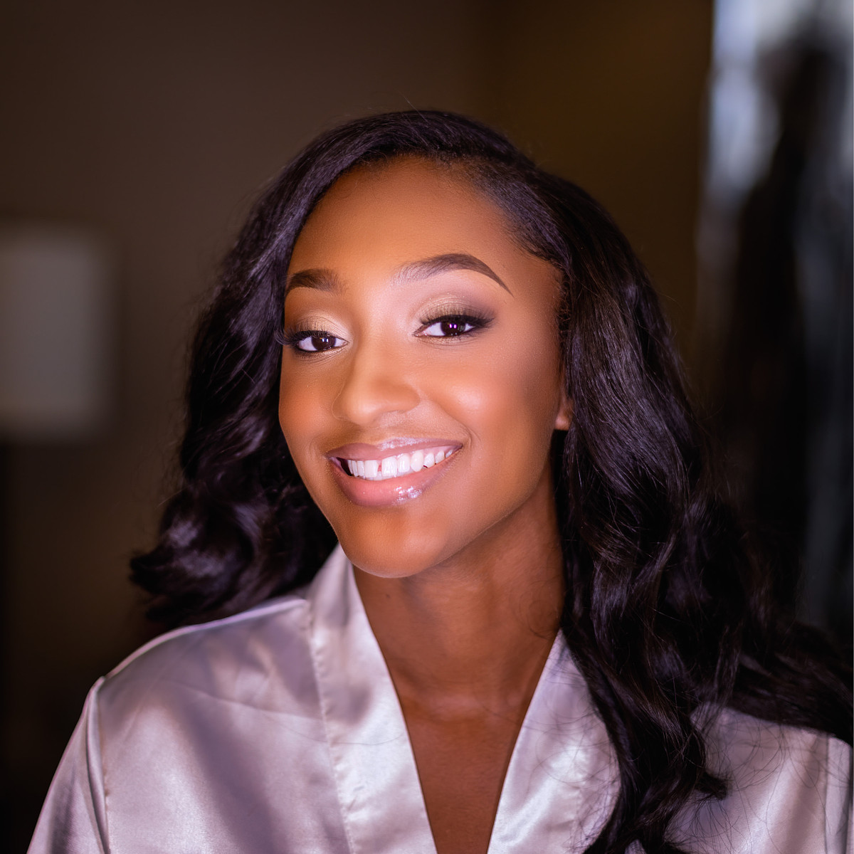 glowing black skin after wedding make-up artist finished applying hydrating lotion