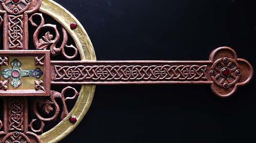 close up picture of the carving on the reliquary after stain and gilding