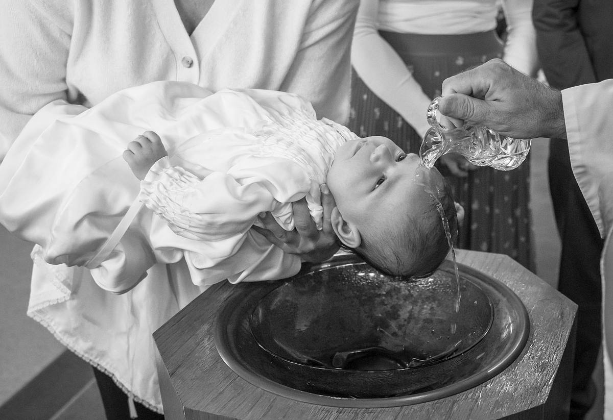 Ottawa Catholic baptism photographer capturing emotional moments