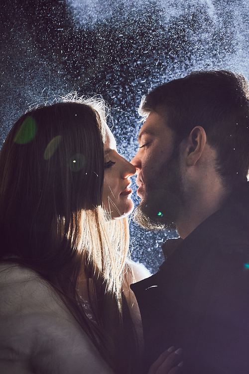 Creative night wedding portrait near Pidhirtsi Castle