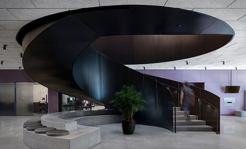 Modern black spiral staircase interior at the Winter Park Library designed by David Adjaye.