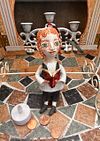 Traditional boy with a book, little ceramic hanging sculpture