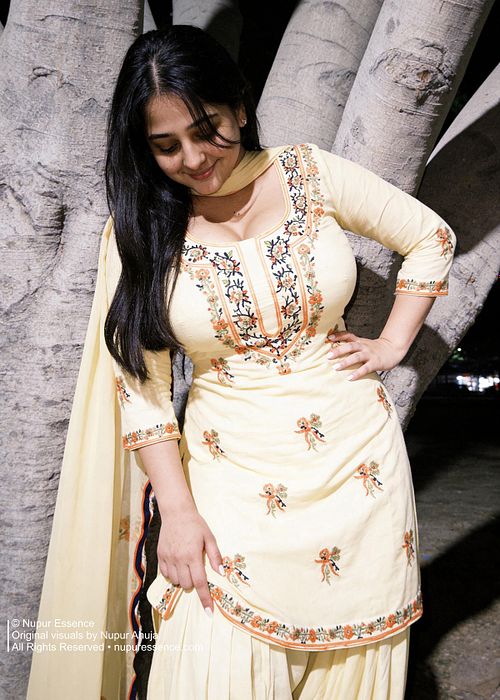 Shy candid portrait featuring Nupur Ahuja in a yellow patiyala suit
