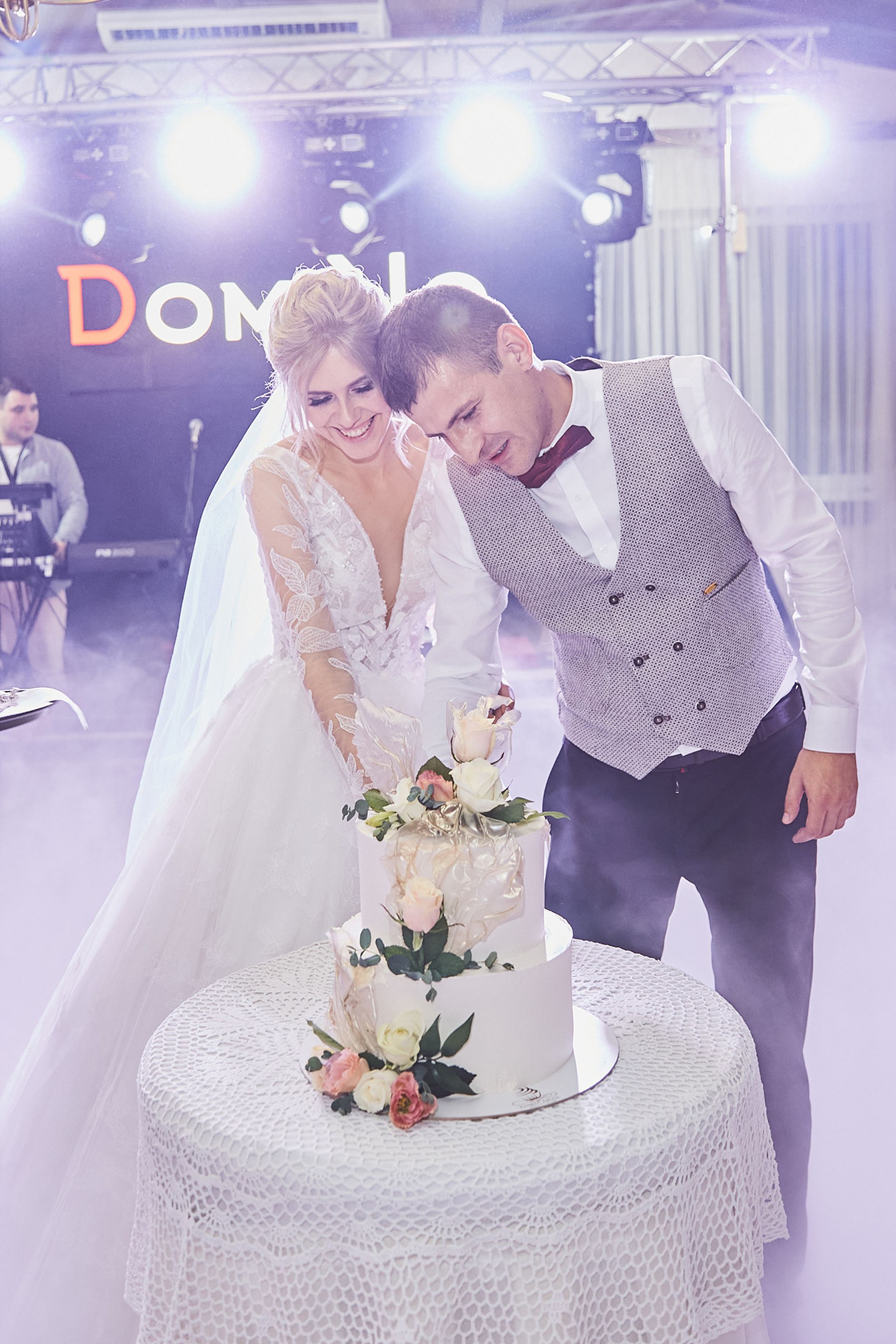 Bride and groom cutting their wedding cake