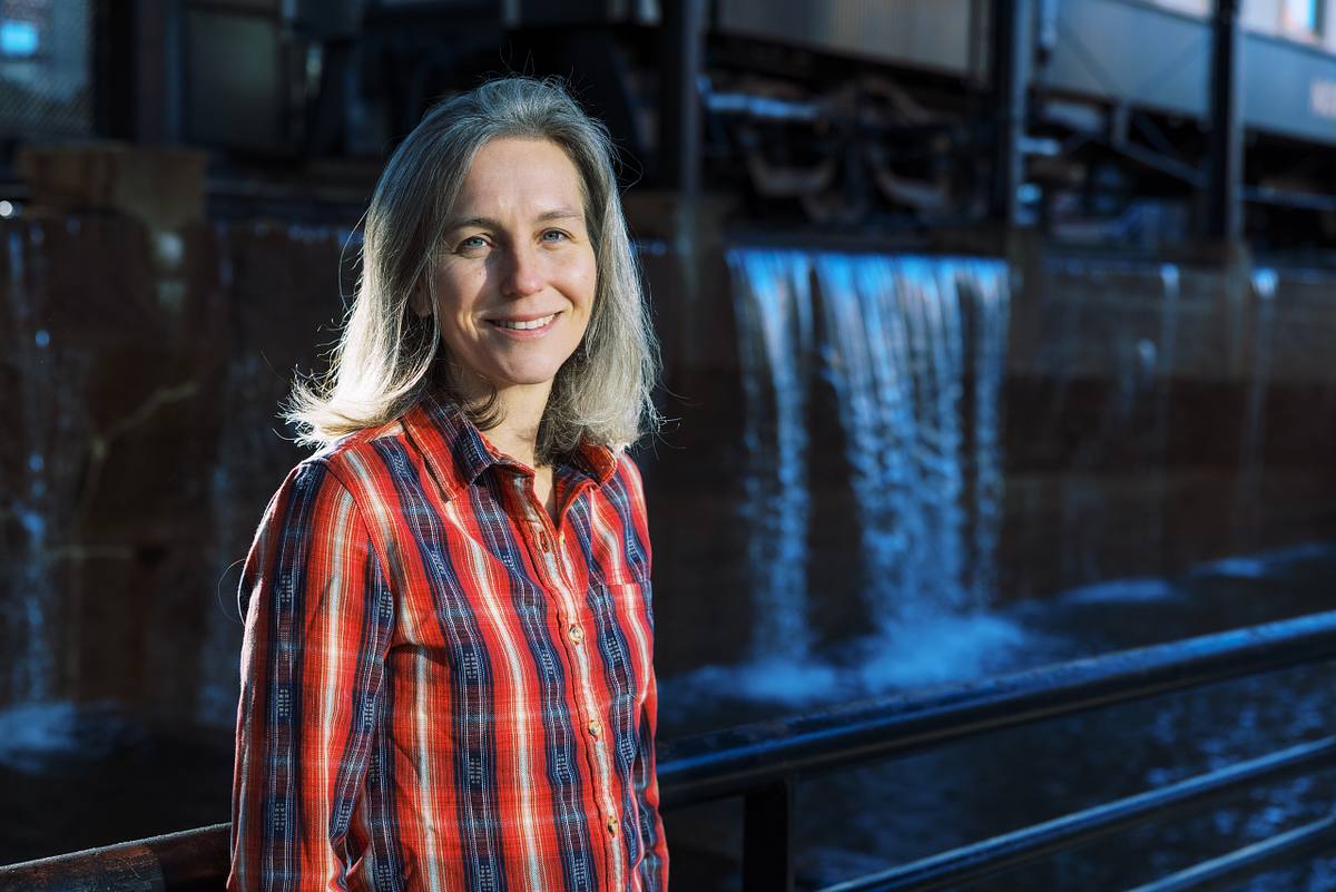 A small business owner posing for an environmental headshot at the American Tobacco Campus in Downtown Durham