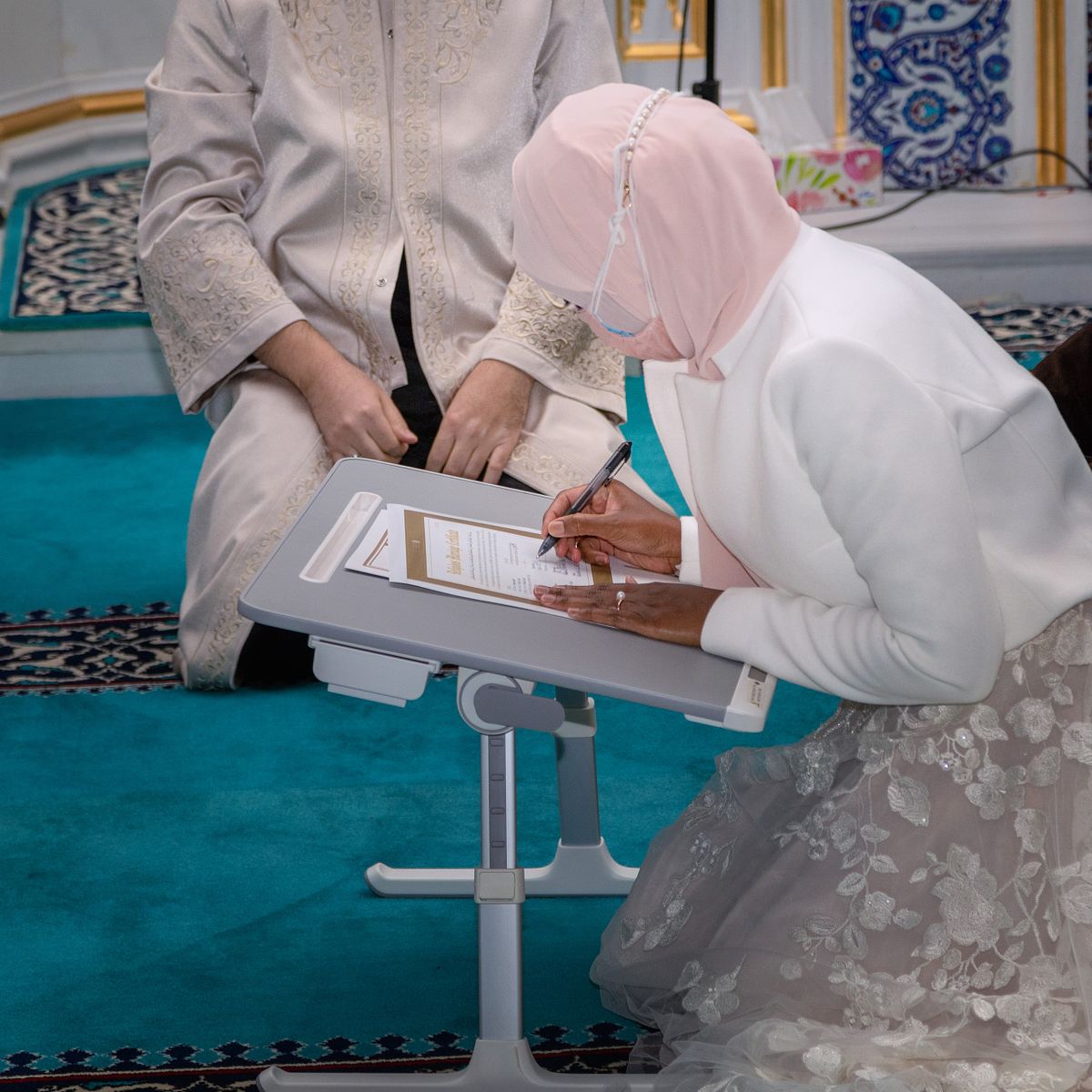 nikal wedding, bride signing the Nikahnama