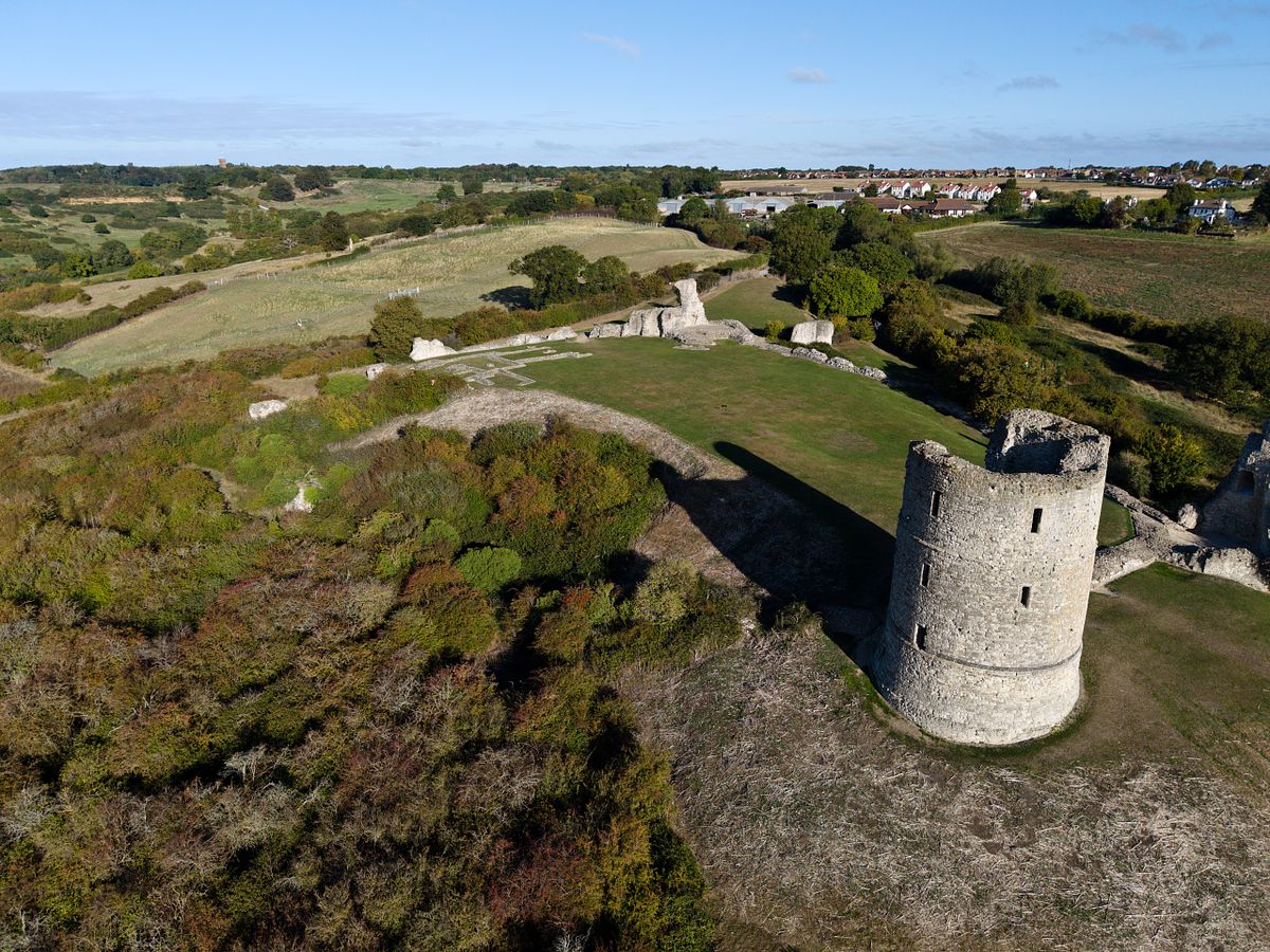 Aerial photograph of Hadleigh Castle surrounded by open countryside, pathways, and textured rural landscape