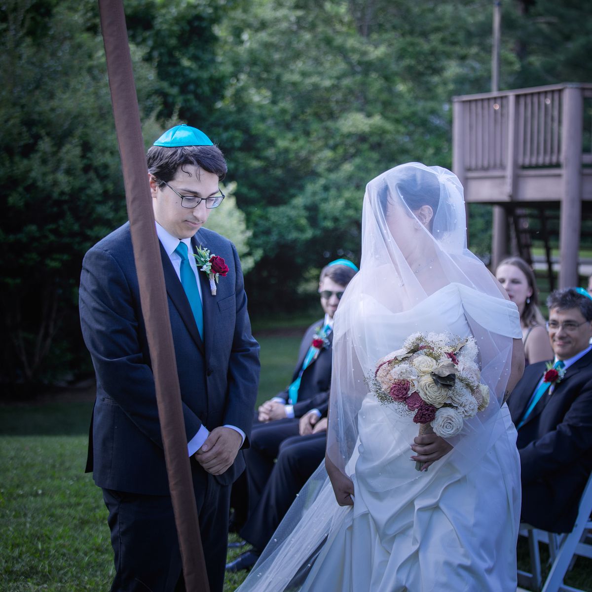 traditional jewish wedding hakafot, the bride dances around the groom 7 times wearing her veil